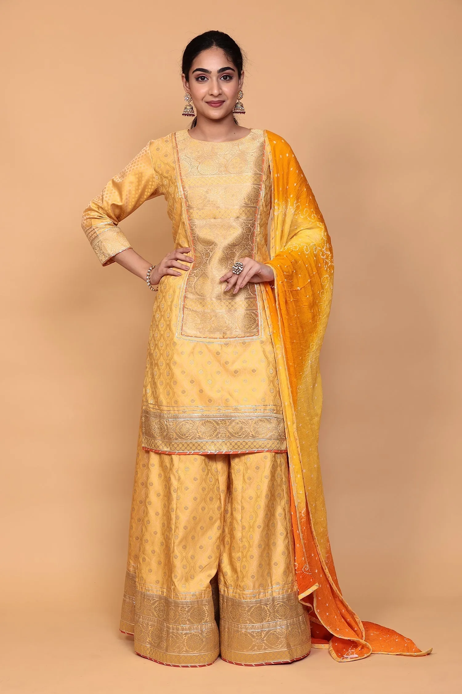 Banarasi Silk Suit with Gota work.